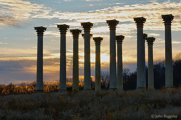 Sunset with a silhouette of the National Capitol Columns