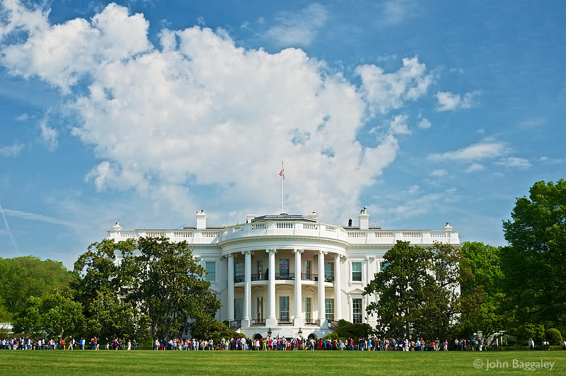 Billowing white clouds over the White House in Washington, DC.