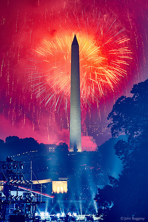 Red Fireworks and a Hazy Monument