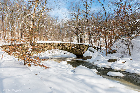 Blue skies over snow-covered Boulder Bridge