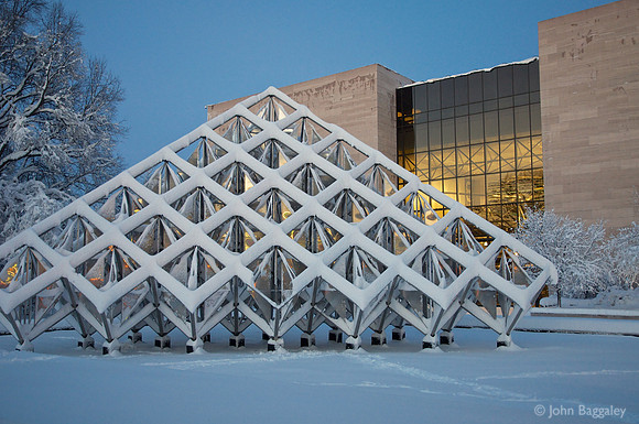 A snowy Smithsonian Air and Space Museum at sunset